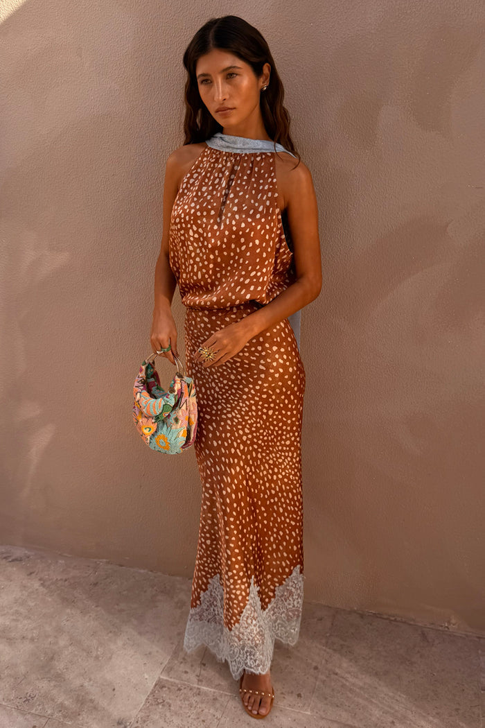 Fawn print Midi Maeva Skirt and matching halter top with a lace trim and beaded bag.