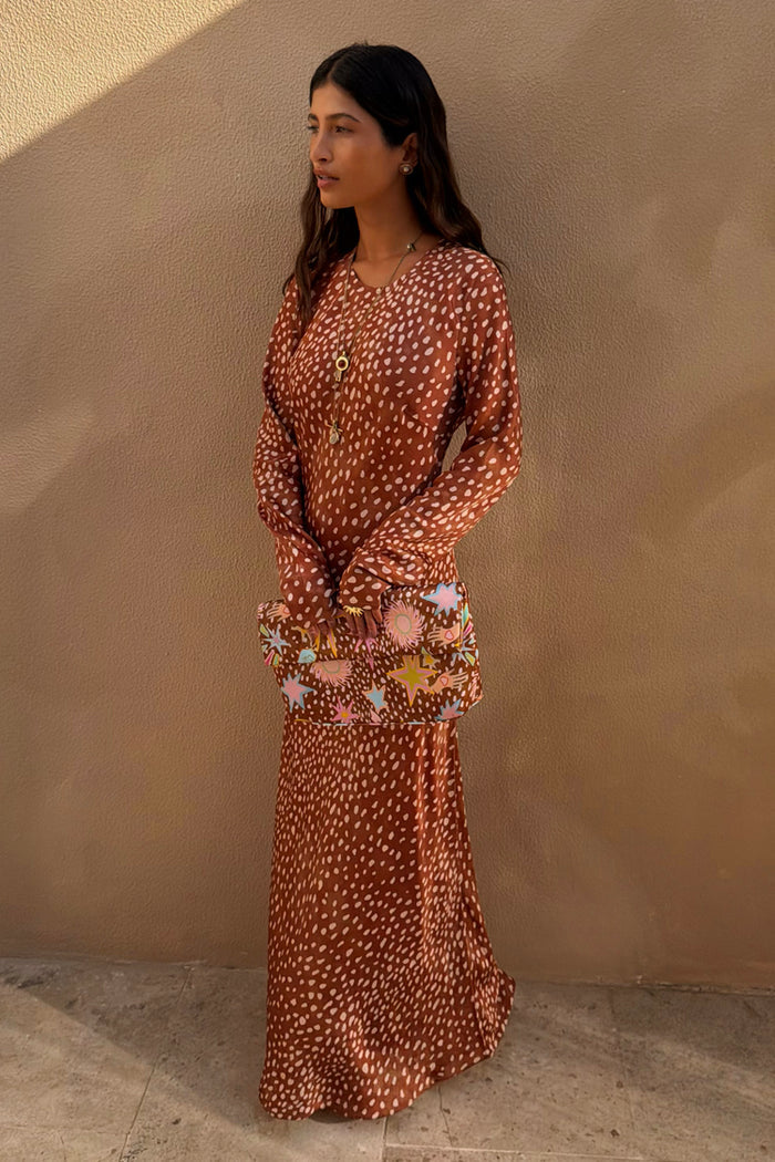 Iconic Fawn Soho Dress in a blush and cream deer print with long flared sleeves and a satin-esque finish.