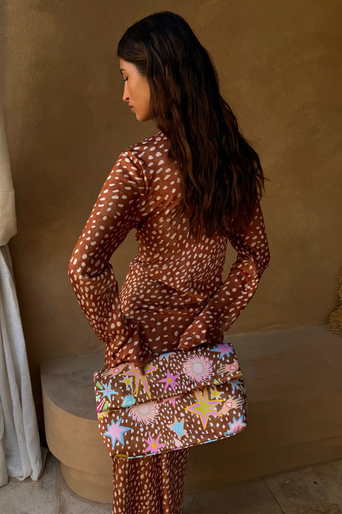 Fawn Soho Dress in brown satin with a spotted deer print and flared sleeves, shown from the back.