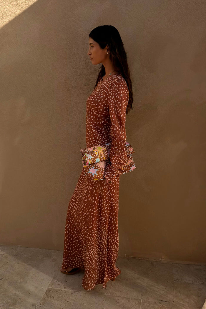Fawn Soho Dress in brown and cream spotted deer print with flared long sleeves and a maxi silhouette.
