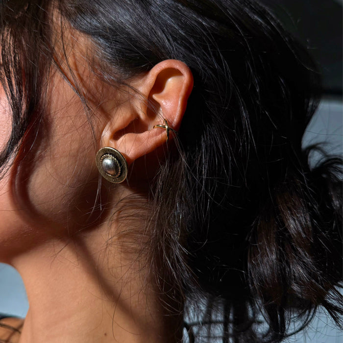 Deloris Silver Circle Earrings with textured brushed metal and vintage-inspired detailing, worn by a model.