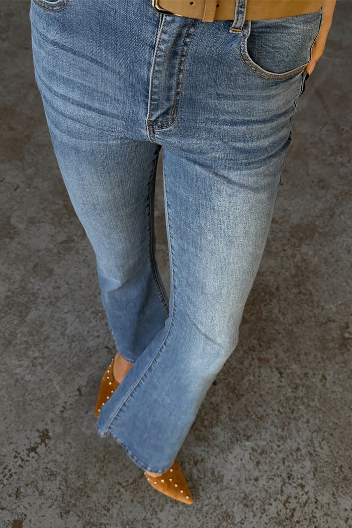 Blue Denim Flare Scallop Jean with a 70s-style flared leg, scallop pockets and faded wash finish.