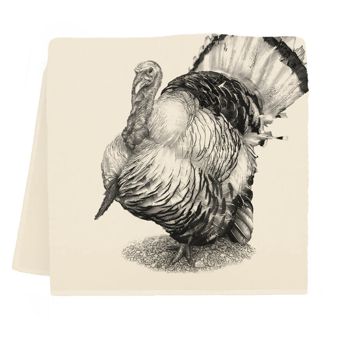 A beige cotton tea towel with a screen-printed black turkey design against a white background.