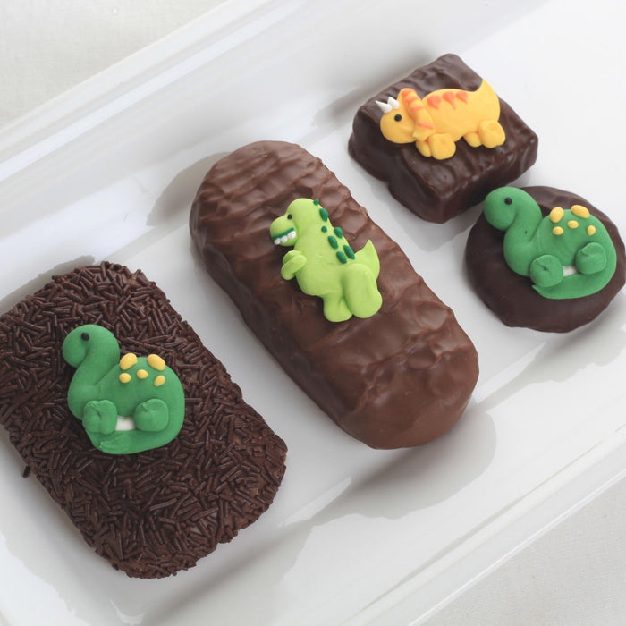 Dinosaur Royal Icing Toppers great for decorating your own chocolates, candy, cupcakes, cakes, cookies and more. Edible Icing Toppers hand piped ready to use out of the box. Great for boys birthdays. Caljava