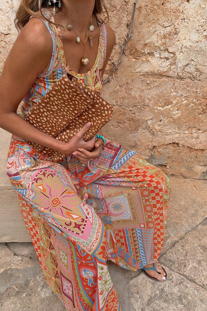 Dolce Vita Balloon Trousers featuring multi-coloured tile panels and sun motifs in a voluminous wide-leg fit.