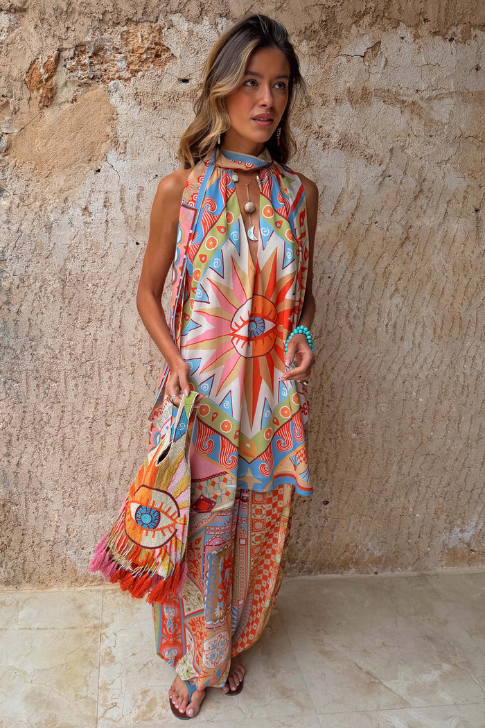 Dolce Vita Balloon Trousers in a vibrant sun and tile print, paired with a matching halter top for a bold co-ord look.