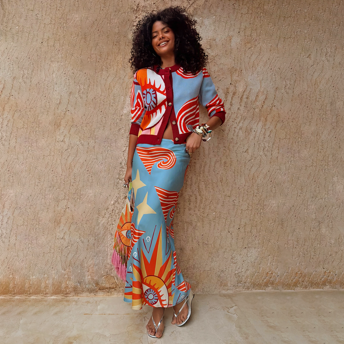 Dolce Vita Dorris Skirt in blue with sun and star motifs, bias cut in a satin-feel fabric with a matching cardigan.