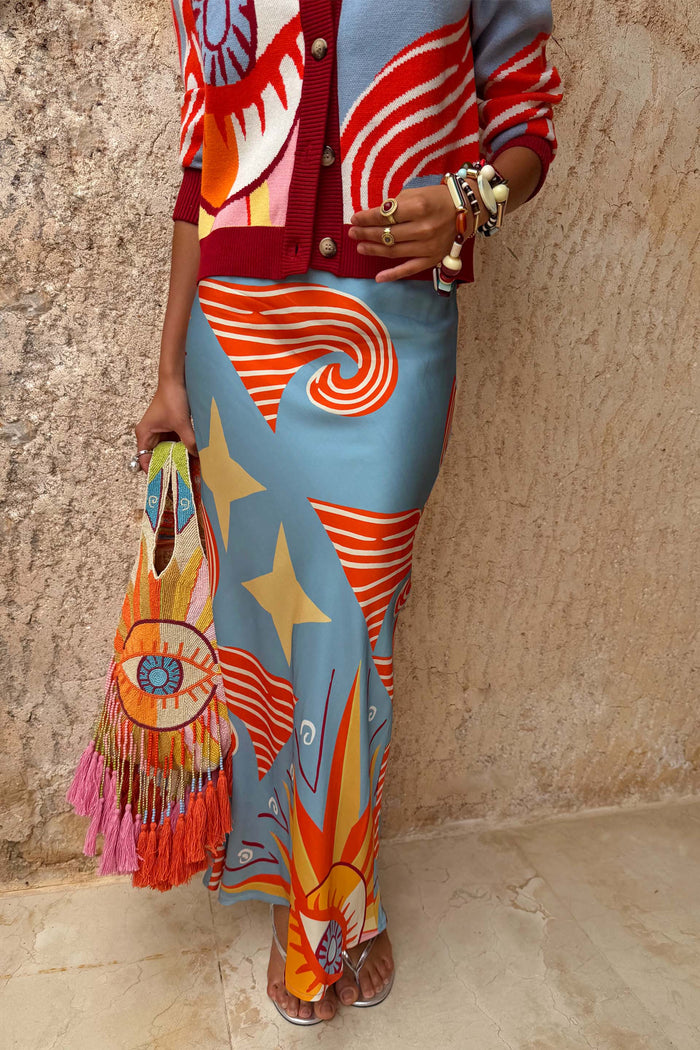 Blue Dolce Vita Dorris Skirt featuring sun and wave motifs in a satin-feel bias-cut silhouette.