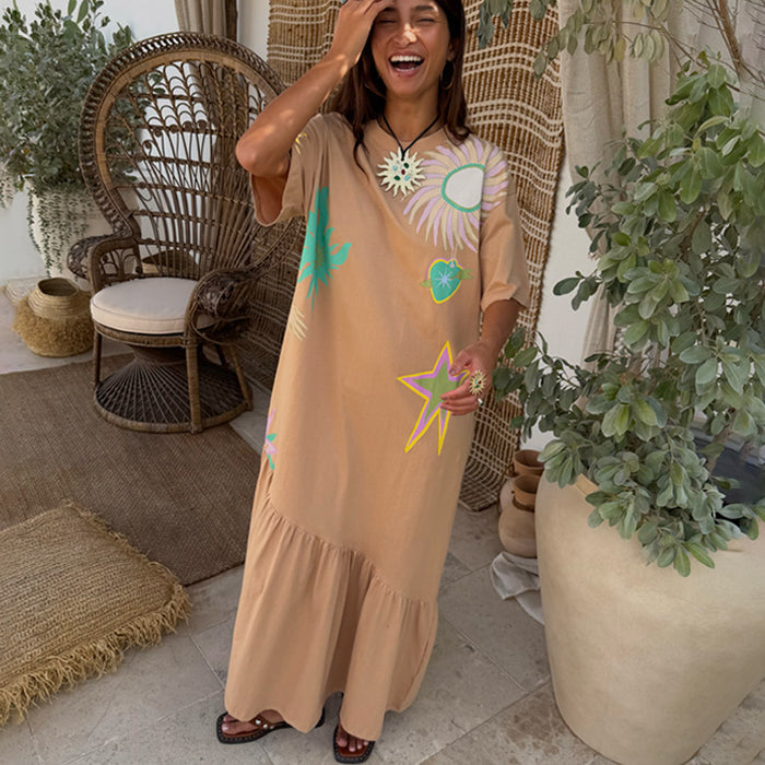 Brown cotton Dreamer T-Shirt Dress with colourful sun and star motifs and an asymmetric gathered skirt.
