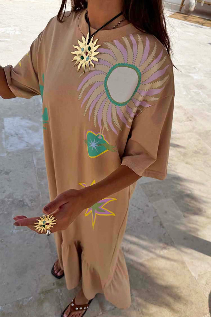 Brown cotton Dreamer T-Shirt Dress featuring colourful sun motifs and an asymmetric gathered skirt.