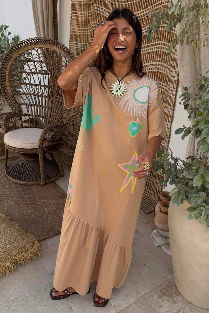 Oversized brown Dreamer T-Shirt Dress in cotton with colourful sun motifs and an asymmetric gathered hem.