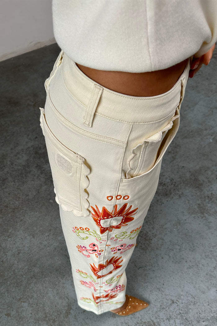 Ecru Enchanted Cut Work Scallop Jeans featuring colourful embroidery and scalloped edge pockets.