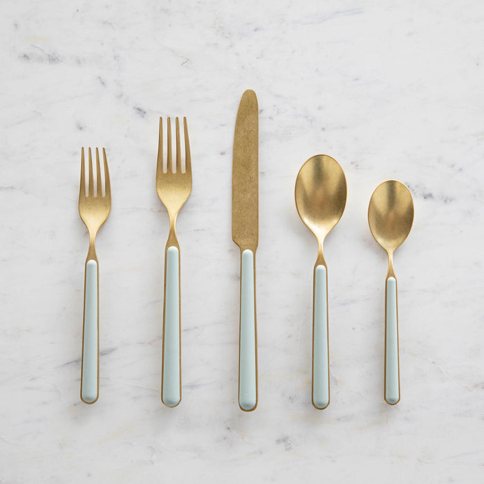 Fantasia Sage 5-Piece Place Setting by Mepra arranged on a marble surface.