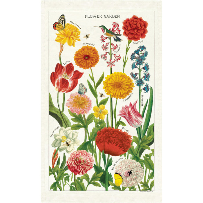 A tea towel with a floral pattern featuring large images of various colorful flowers such as tulips and marigolds, along with butterflies and a hummingbird.