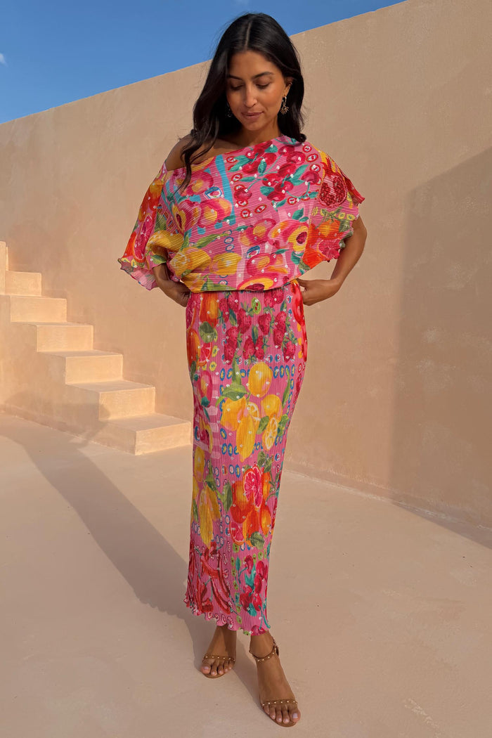 Pink Fruit Tilly Dress featuring a citrus fruit print, metallic fleck and an off-shoulder midaxi silhouette.