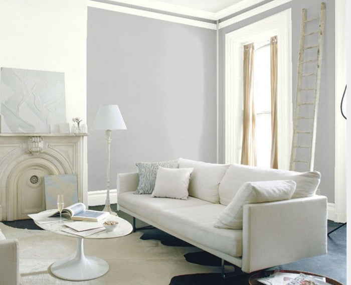 Retique It furniture and cabinet paint in a quart container, showcasing a smooth, painted furniture surface in a natural setting.
