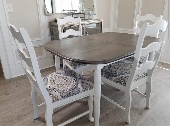 Retique It furniture and cabinet paint in Snow, a quart-sized container, shown with a painted table surface in the image.