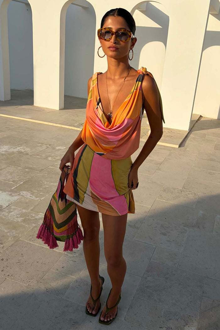 Green Abstract Leila Mini Dress with a cowl neck and multi-wear tie straps in a multi-coloured vacation print.