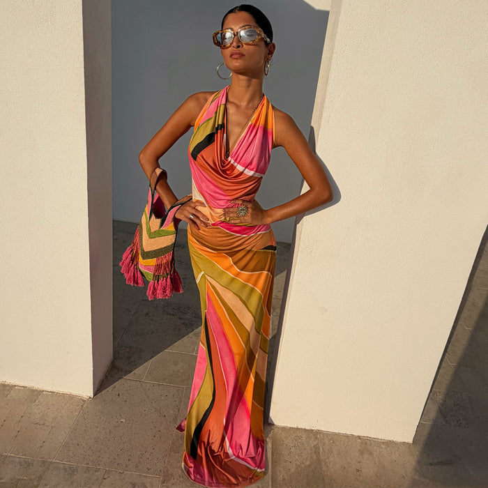Green Abstract Sabine Maxi Dress featuring a vibrant multicoloured wavy print, cowl neckline, and halter neck.