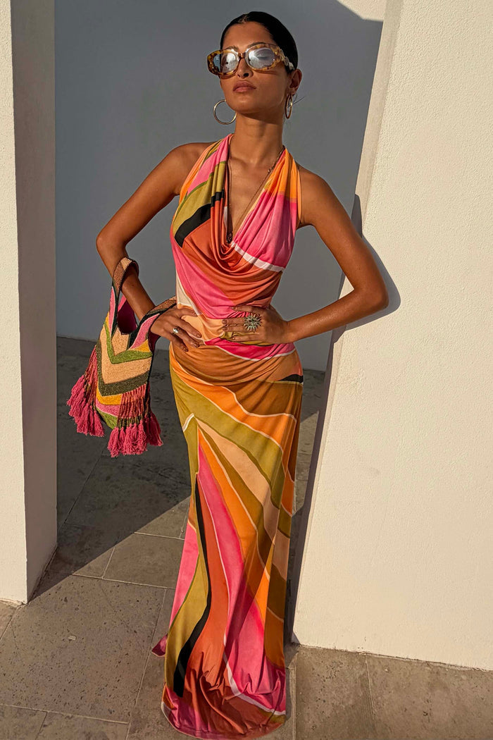 Green Abstract Sabine Maxi Dress in a vibrant multicoloured print with a halter cowl neckline and backless silhouette.
