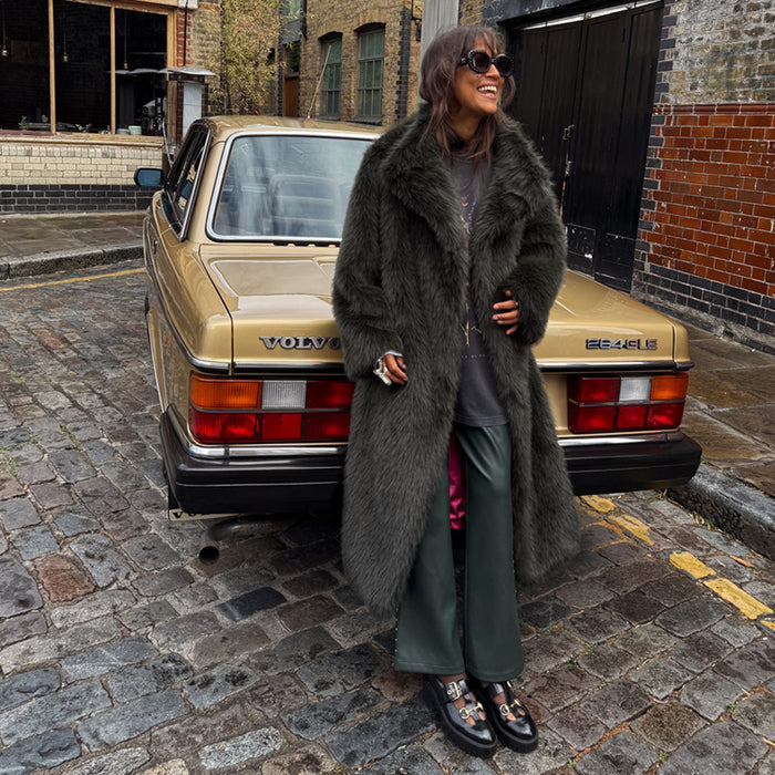 Green Faux Fur Coat with a soft texture and relaxed silhouette, worn by a model leaning on a vintage gold car.