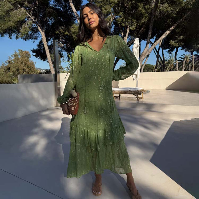 Petite Green Harmony Dress with gold jacquard animal print and tiered skirt, worn for feel good dressing on vacation.