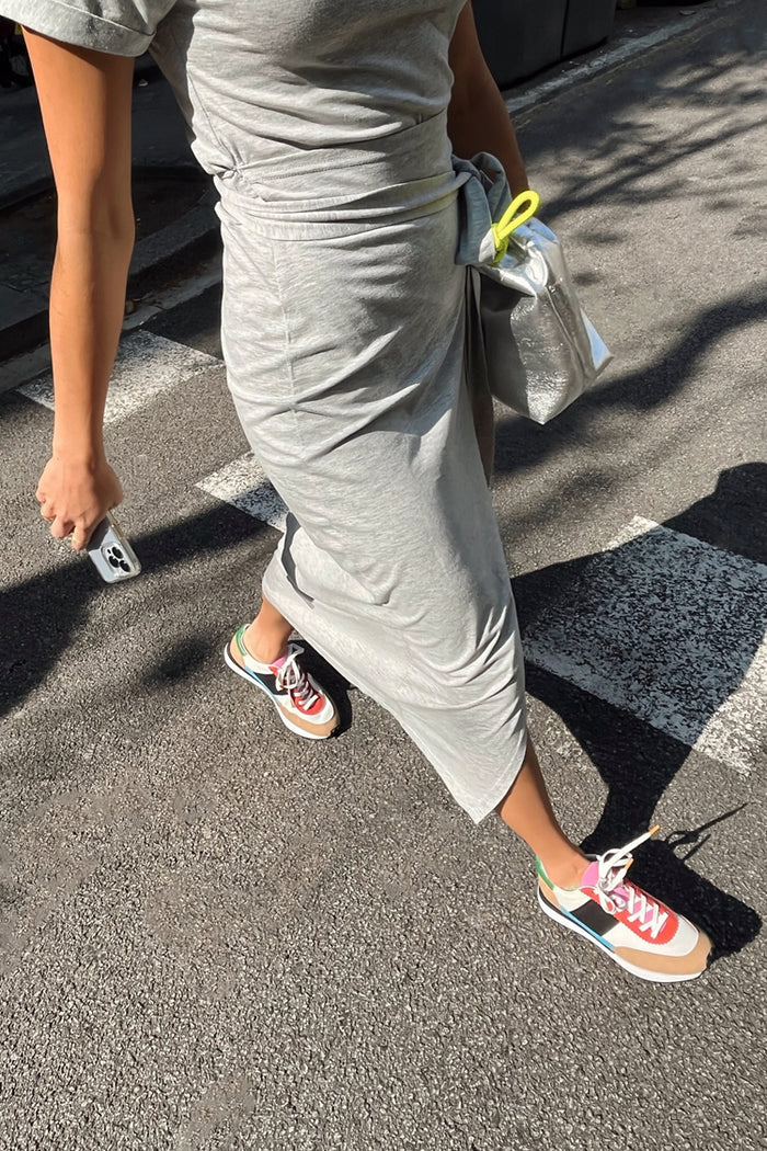 Grey marl Jesse Jersey Wrap Dress with a multi-wear tie, styled with colourful trainers for a casual street style look.