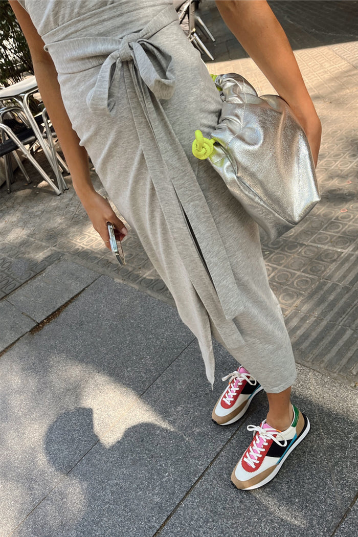 Grey Jesse Jersey Wrap Dress with a front tie-waist in soft marl, styled with a silver bag and trainers.