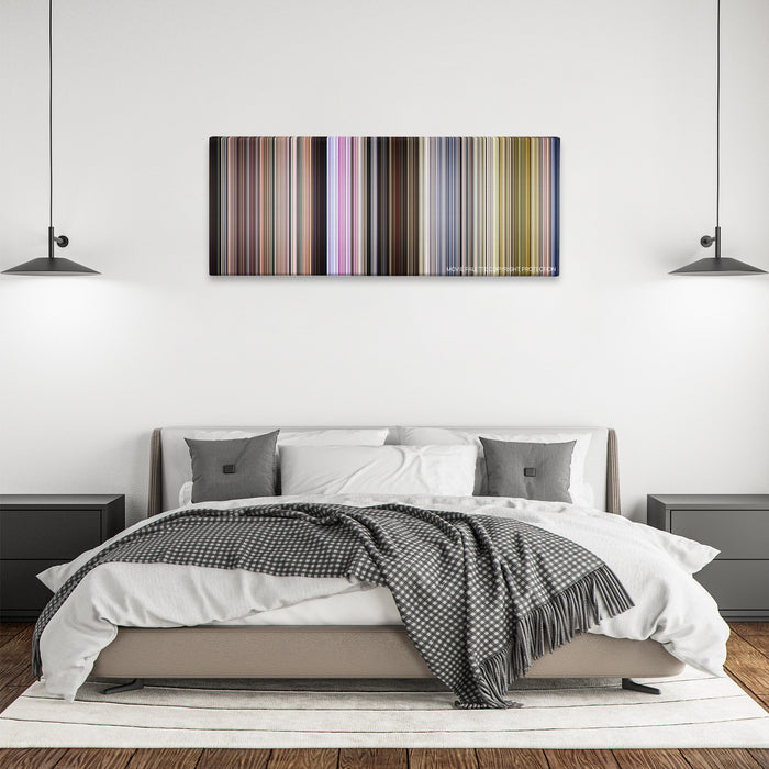 Groupers color palette canvas above a bed, between two black pendant lamps