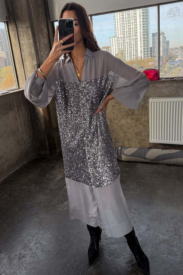 Gunmetal Sequin Lila Shirt Dress with shimmering silver sequins and a relaxed silhouette, shown in a mirror selfie.