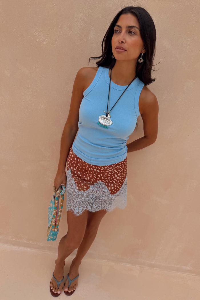 Ice Blue Ribbed Tank Top in soft stretch fabric, a versatile capsule wardrobe staple for summer styling.