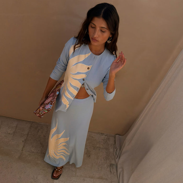 Ice Blue Sol Alexa Cardigan with a hand-painted sun print, paired with a matching ribbed midaxi skirt co-ord.
