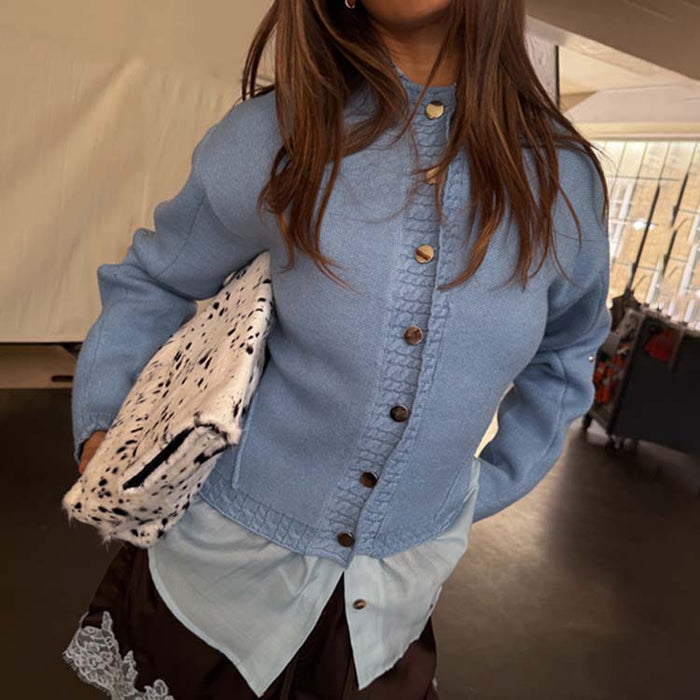 Ice Blue Studded Cardigan with silver metal studs and twist stitch detailing, layered over a light blue shirt.