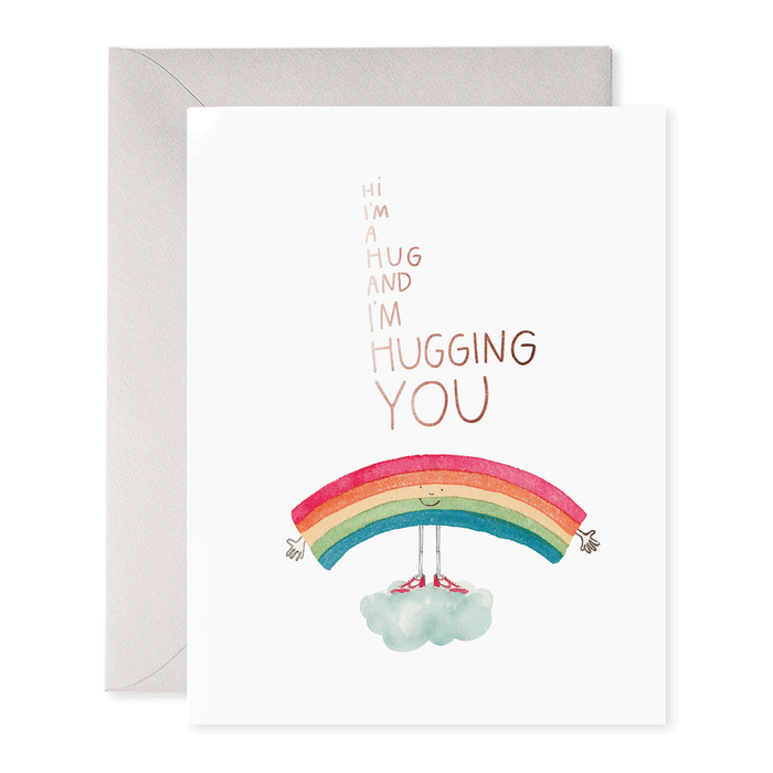 Greeting card with an original watercolor rainbow illustration and the text "hi i'm a hug and I'm hugging you," accompanied by an envelope, printed on heavyweight paper, made by E. Frances' I'm a Hug Card.