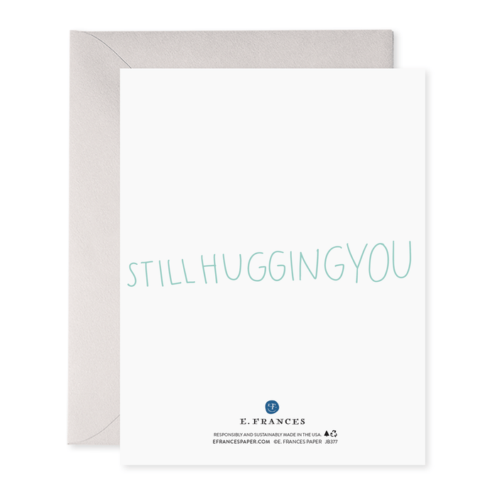 Greeting card with an original watercolor rainbow illustration and the text "hi i'm a hug and I'm hugging you," accompanied by an envelope, printed on heavyweight paper, made by E. Frances' I'm a Hug Card.