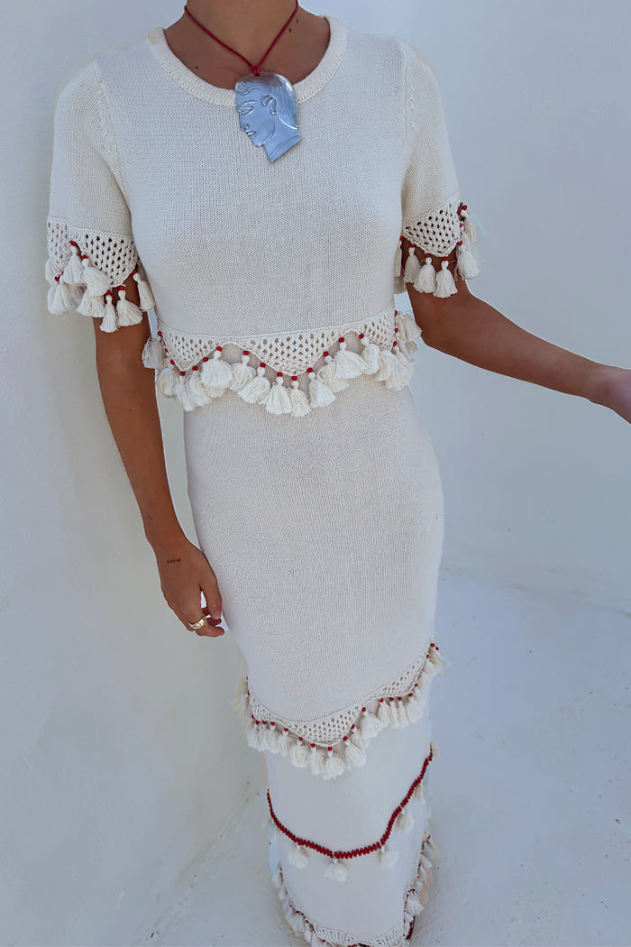 Ivory and Red Harper Dress in cream knit with scallop crochet and red bead tassel detailing.