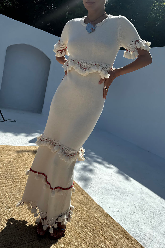 Ivory and Red Harper Dress in cream crochet knit with tassel detailing and red bead accents.