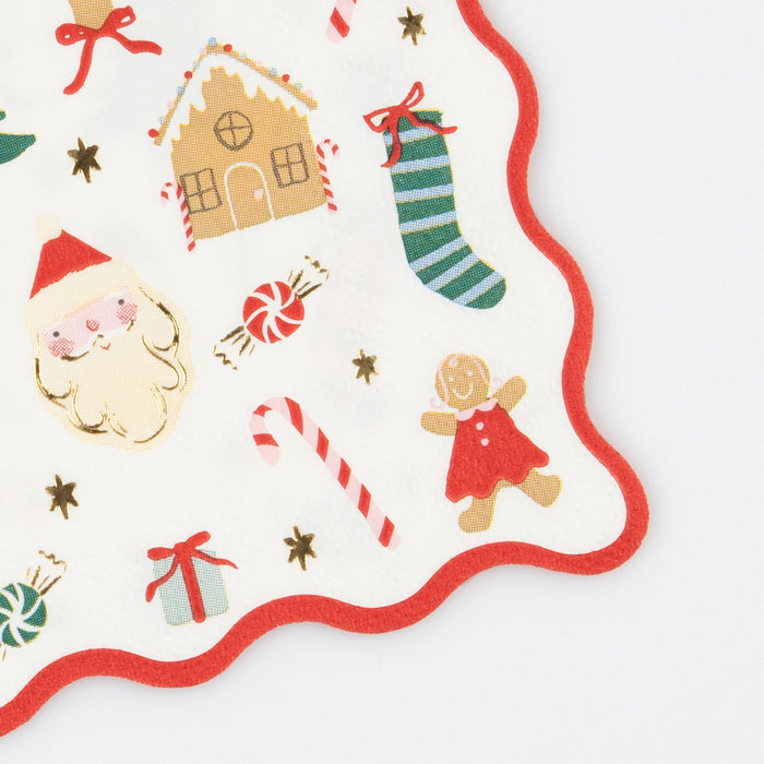 Close up of Jolly Christmas Napkin showing red scalloped border and Christmas icons.