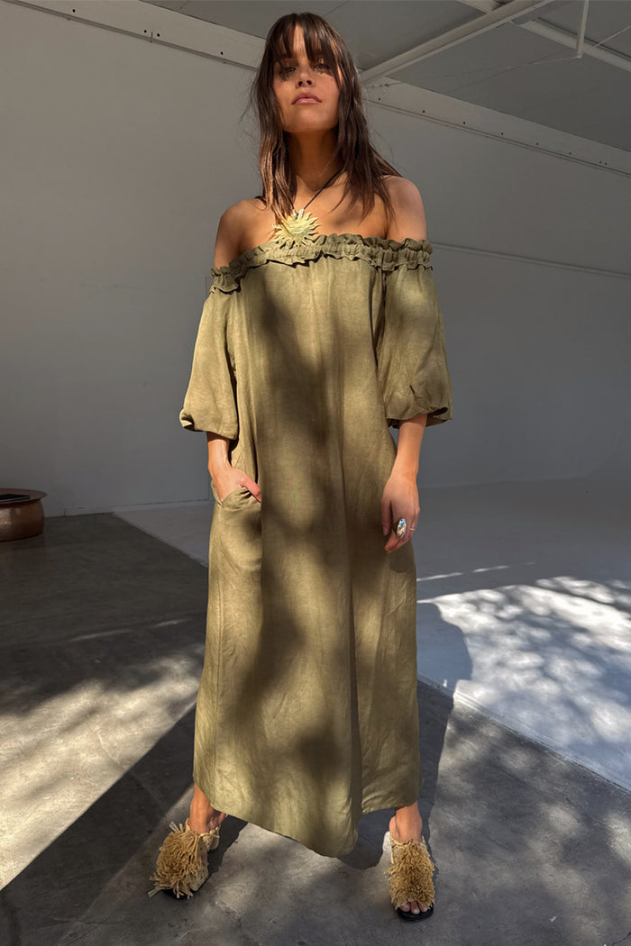 Khaki Ella Dress in a green linen blend with an off-the-shoulder ruffled neckline and side pockets.