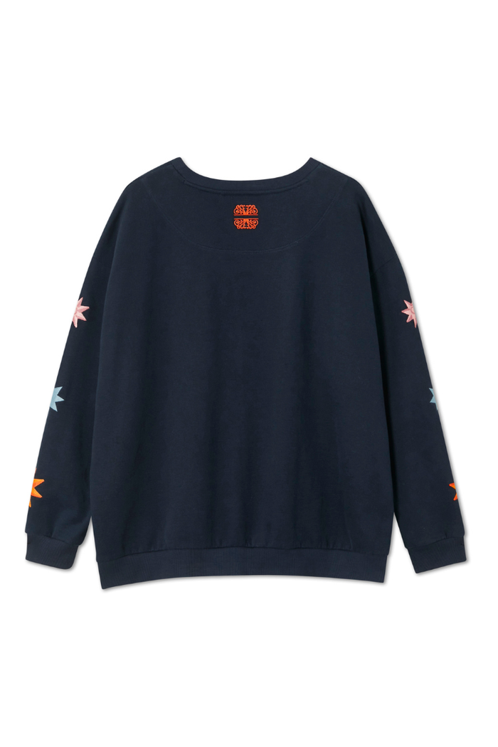 Navy Charm Sweatshirt featuring colourful star motifs on the sleeves and an orange logo detail at the back neck.