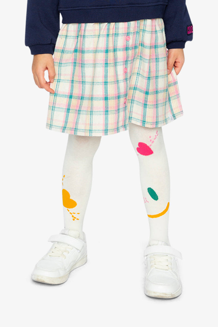 Deux par Deux girls' off-white knit tights with graphic details – worn with a skirt by a child model