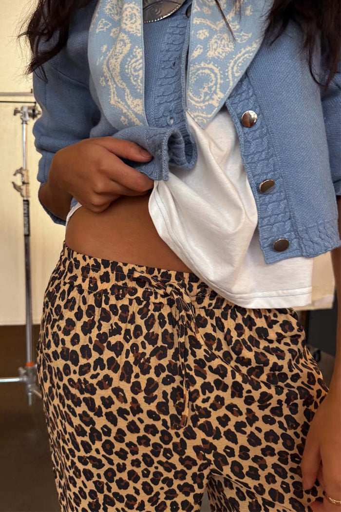 Lucia Leopard Elissa Trousers detail highlighting the elasticated drawstring waist and iconic leopard print.