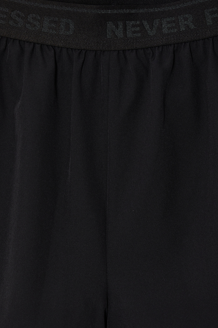 Black Map Running Short featuring a signature Never Fully Dressed branded elasticated waistband detail.