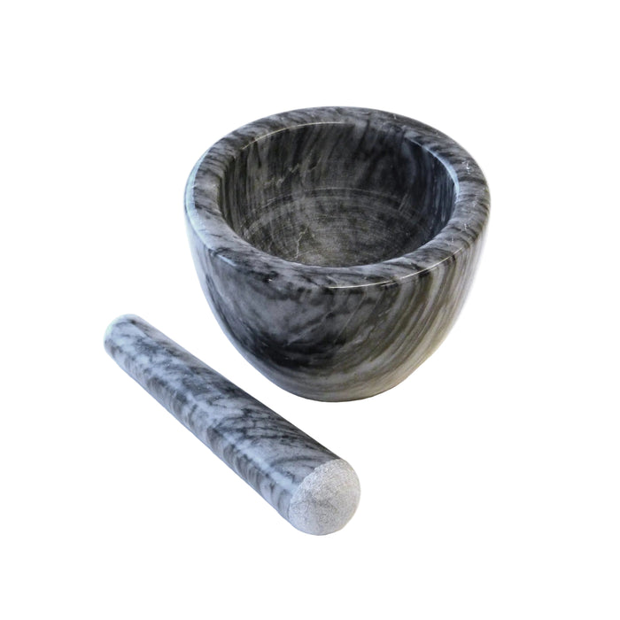 Marble mortar and pestle from RSVP International for grinding herbs and spices, showcasing the smooth marble surface and pestle.