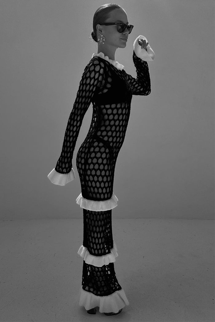 Mono Crochet Chloe Dress with black fishnet-style knit and white frilled detailing at the cuffs and hem.