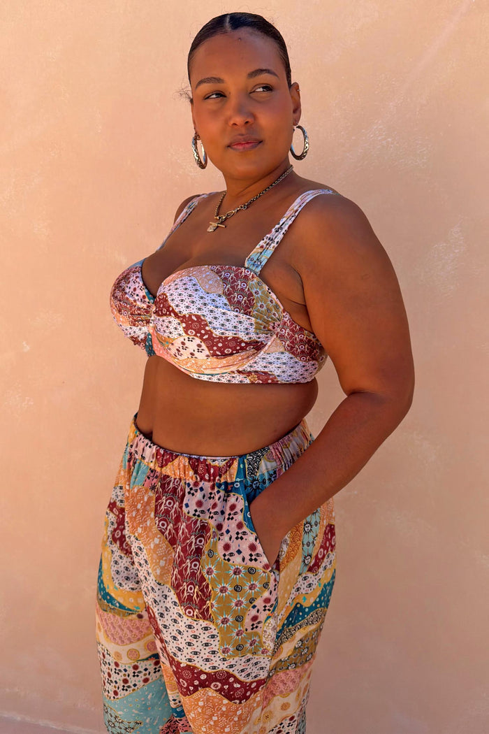 Underwired Morocco Bikini Top with celestial patchwork print, worn with matching high-waisted beach trousers.
