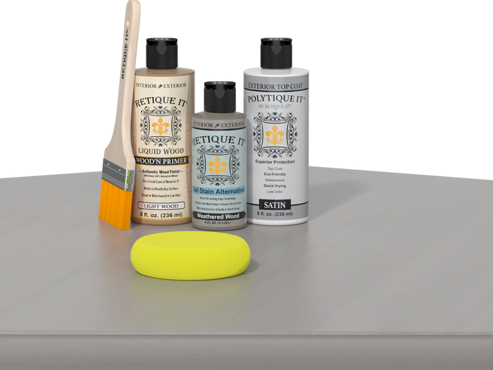 Retique It® Light Wood kit with brush, Weathered Wood stain alternative, and satin top coat on a reflective surface.