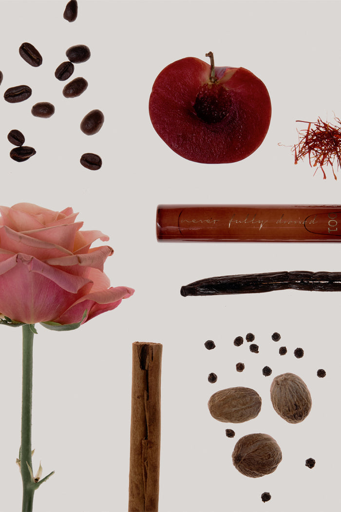 NFD Eau De Parfum 001 10ml bottle with notes of pink rose, coffee beans, plum, saffron, vanilla, cinnamon, and nutmeg.