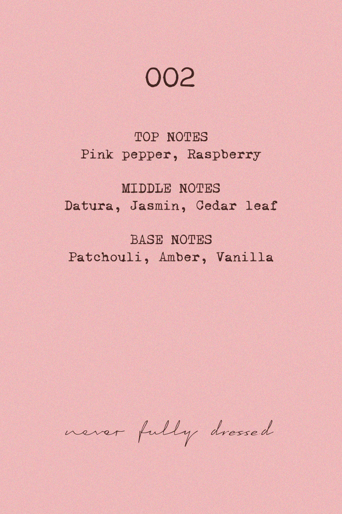 NFD Eau De Parfum 002 fragrance notes graphic on a pink background, listing pink pepper, raspberry, jasmine and vanilla.