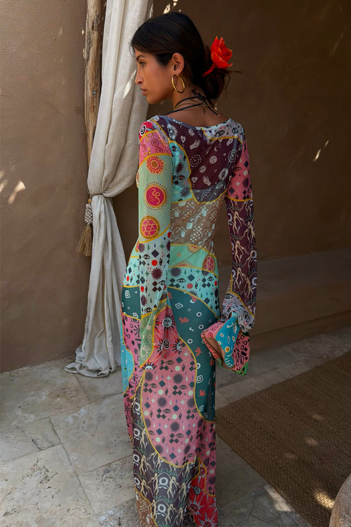 Sheer multi-wear Pastel Morocco Mesh Vivi Dress with sun and eye motifs, perfect for effortless feel good dressing.